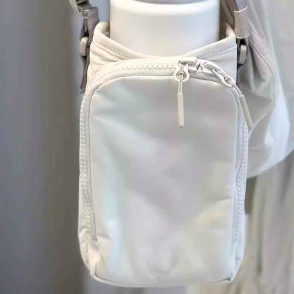 The Bottle Sling — Waterproof Crossbody for Phone and Keys
