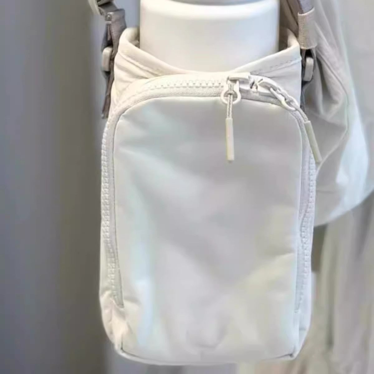 The Bottle Sling — Waterproof Crossbody for Phone and Keys