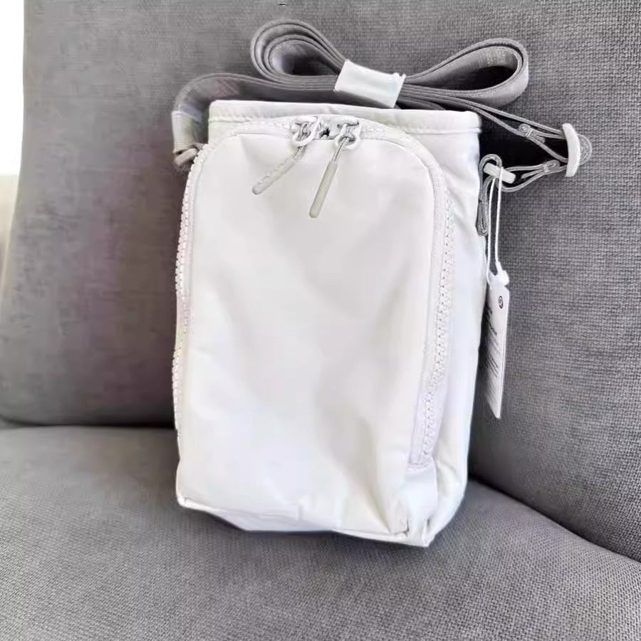 The Bottle Sling — Waterproof Crossbody for Phone and Keys