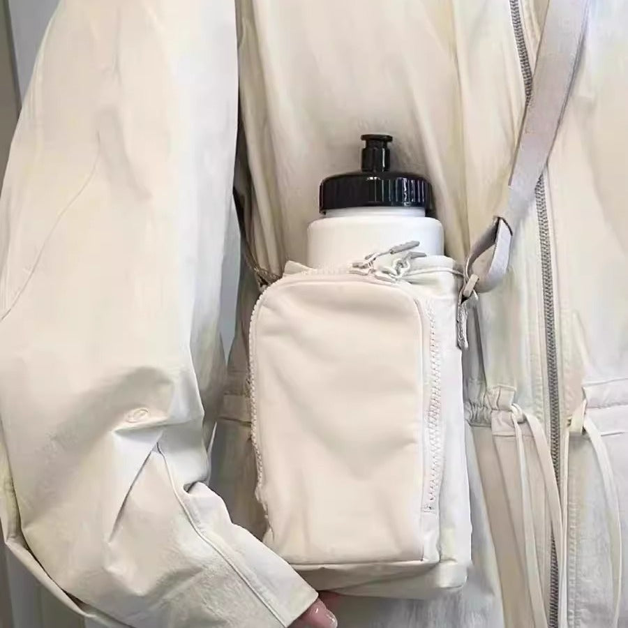 The Bottle Sling — Waterproof Crossbody for Phone and Keys